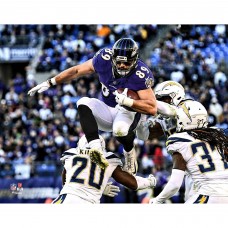 Unsigned Baltimore Ravens Mark Andrews Fanatics Authentic Hurdling Defender Photograph