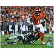 Autographed Cincinnati Bengals JaMarr Chase Fanatics Authentic 8 x 10 Breaking Tackle Photograph