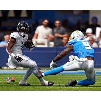 Unsigned Jacksonville Jaguars Travis Etienne Fanatics Authentic Maneuvers Past Defense Photograph