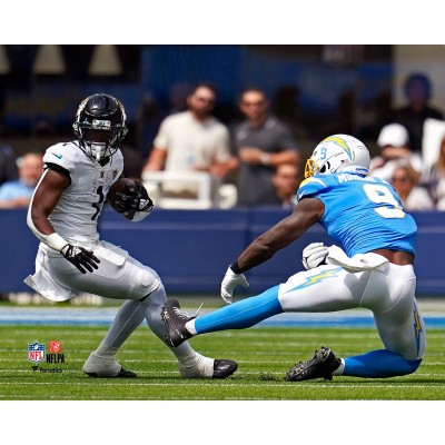 Unsigned Jacksonville Jaguars Travis Etienne Fanatics Authentic Maneuvers Past Defense Photograph